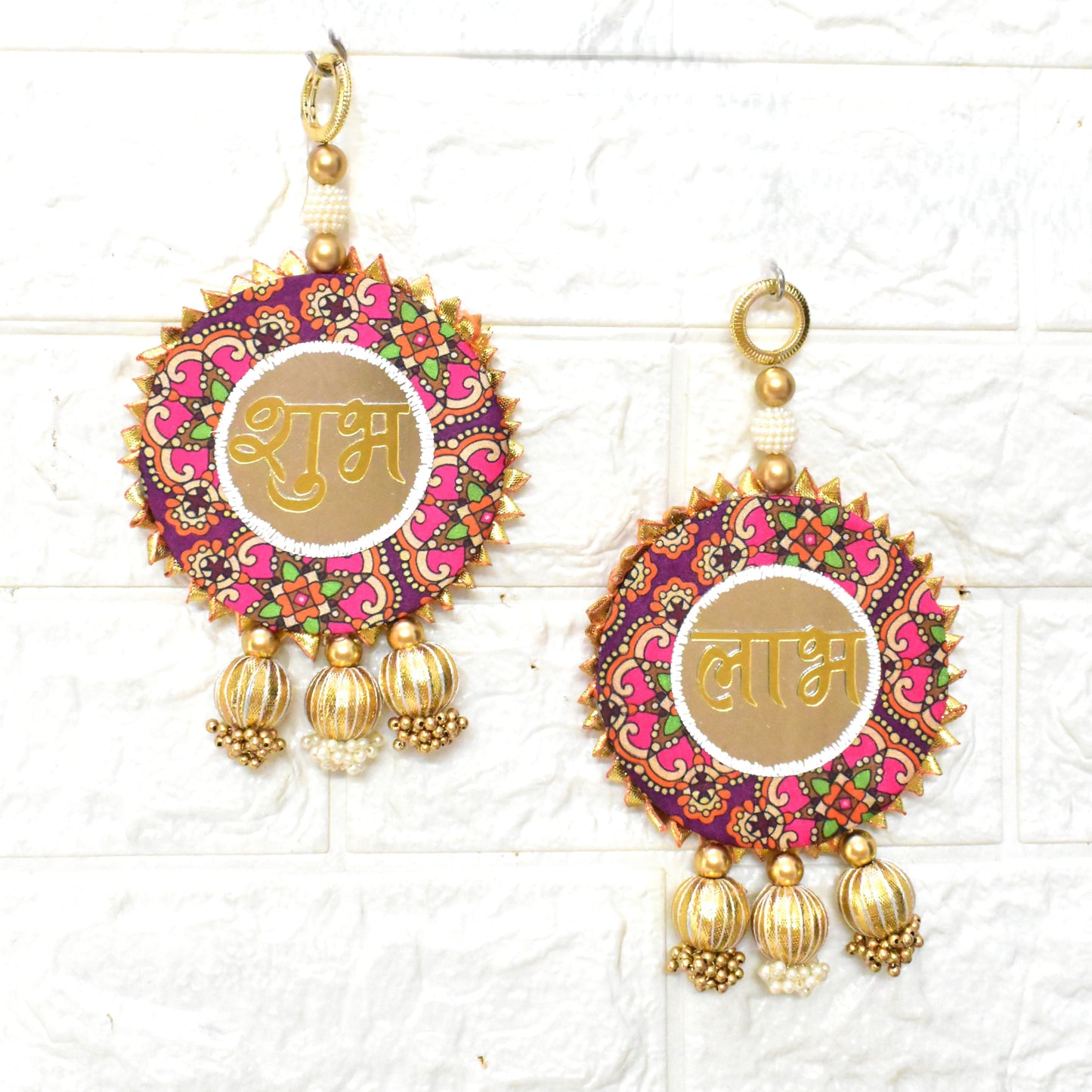 Decorative Shubh Labhs with colorful designs and gold accents