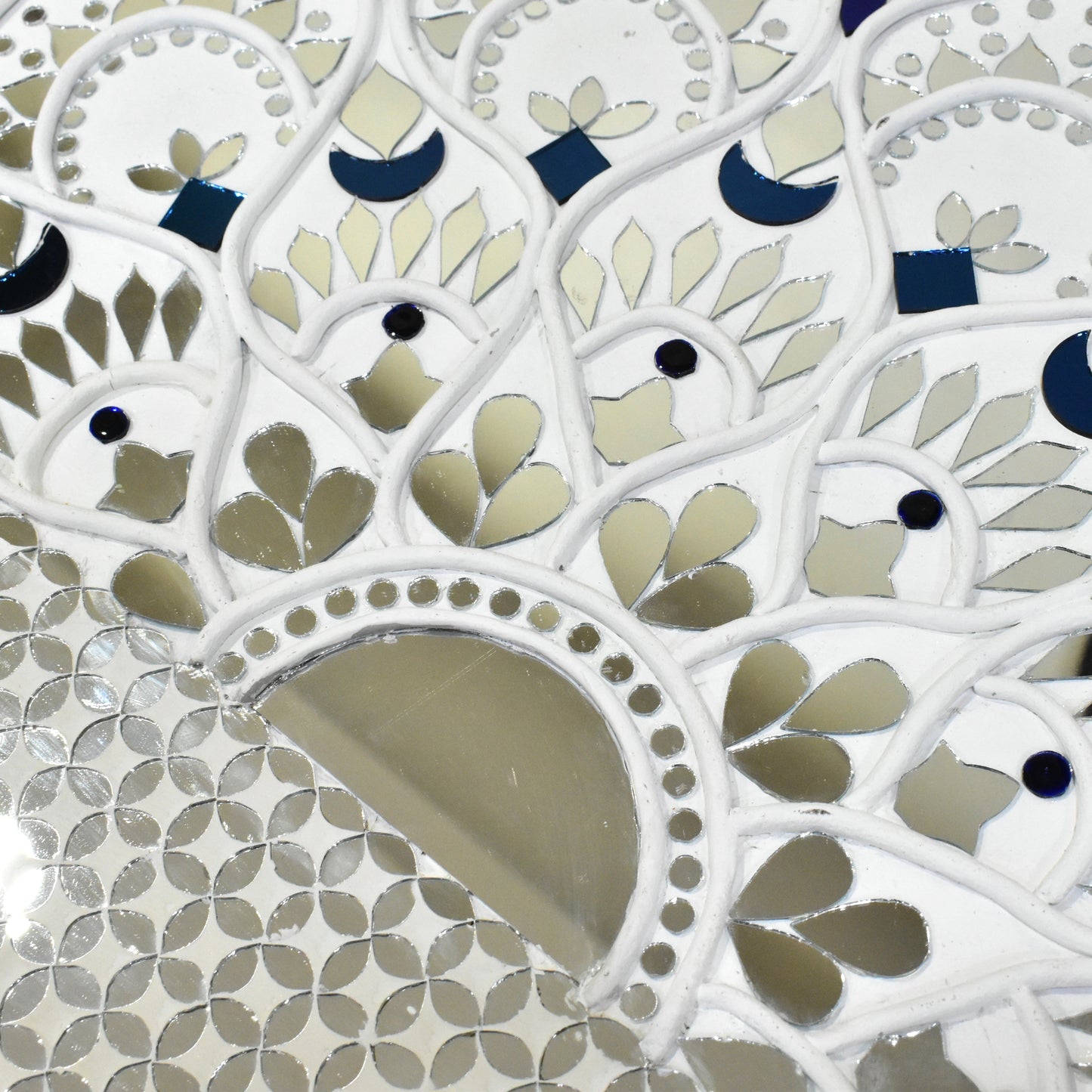 Close up of white mandala mirror mosaic wall art