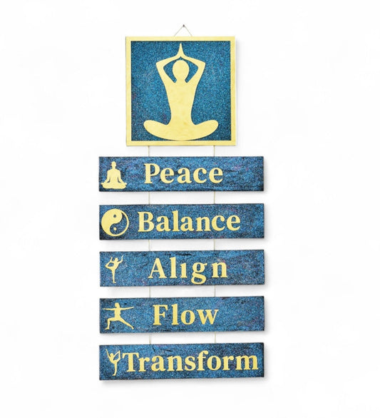 Yoga-themed wall decor with text 'Peace', 'Balance', 'Align', 'Flow', 'Transform' on a blue background.