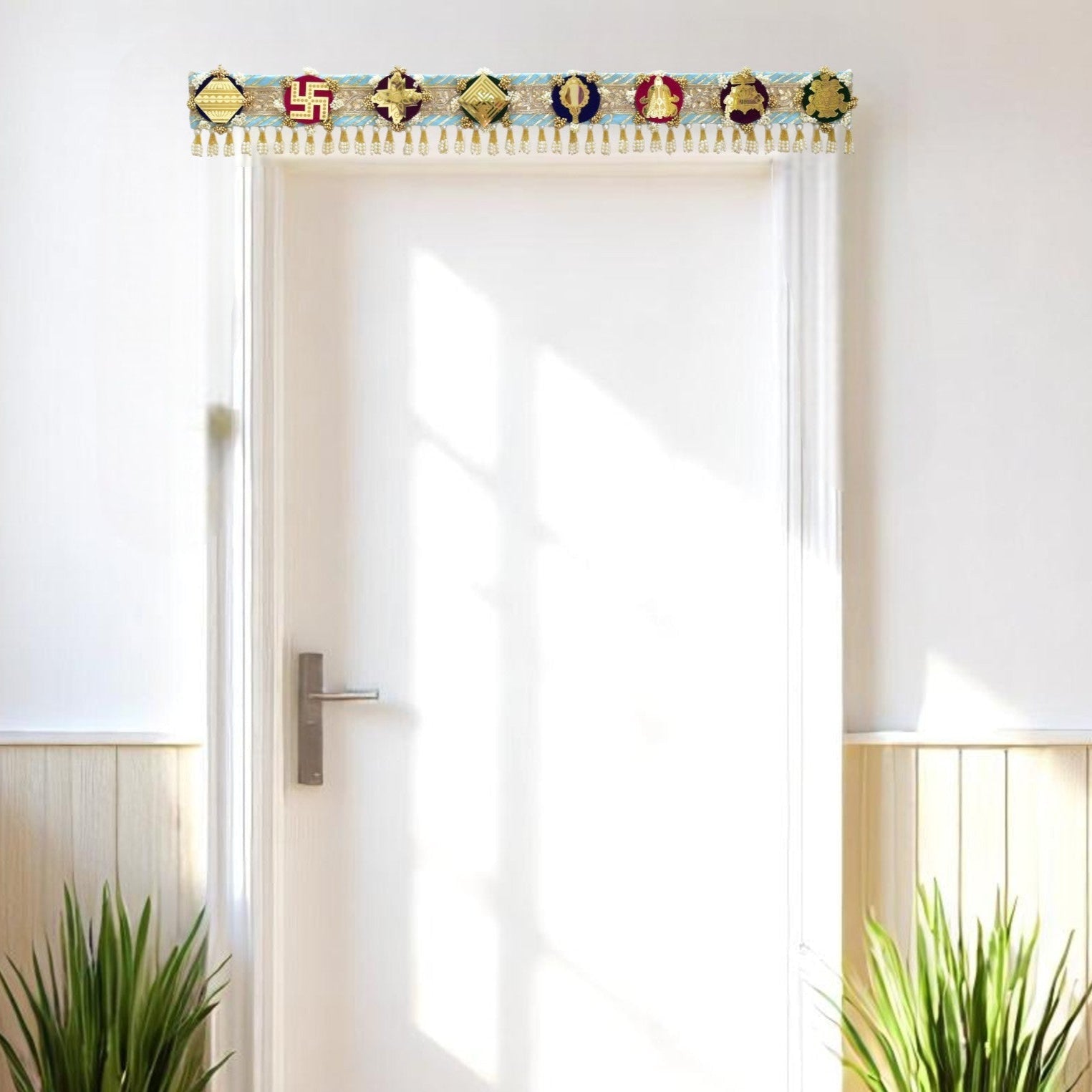 Modern interior with a white door, plants, and decorative toran ashtamangal jain gift.