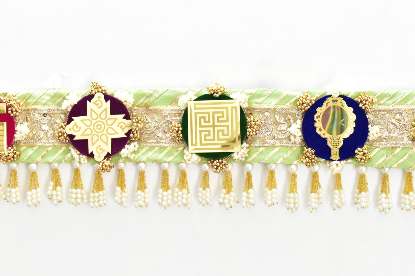 Green handcrafted Ashthamangala toran with traditional mirror work and 8 sacred symbols, ideal for ethnic home décor, door hanging, or pooja room decoration