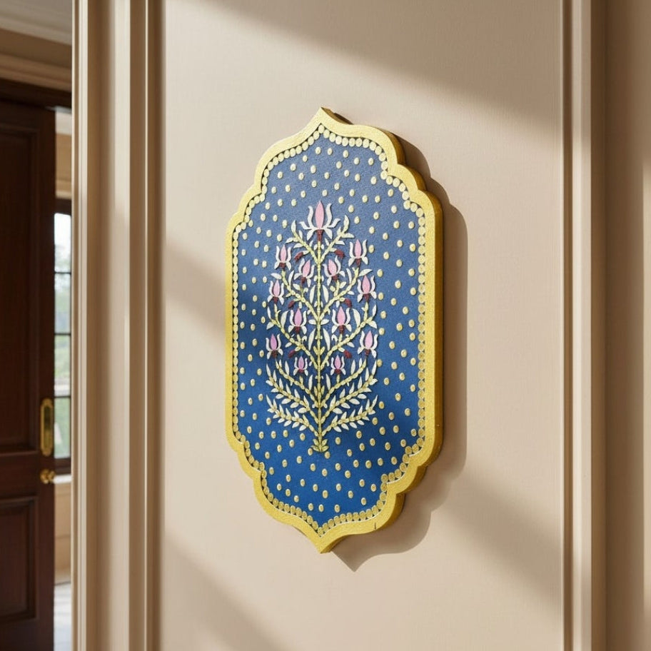 Ethnic Indian wall art with lotus floral designs and mirrors  in blue colour on a beige living room wall