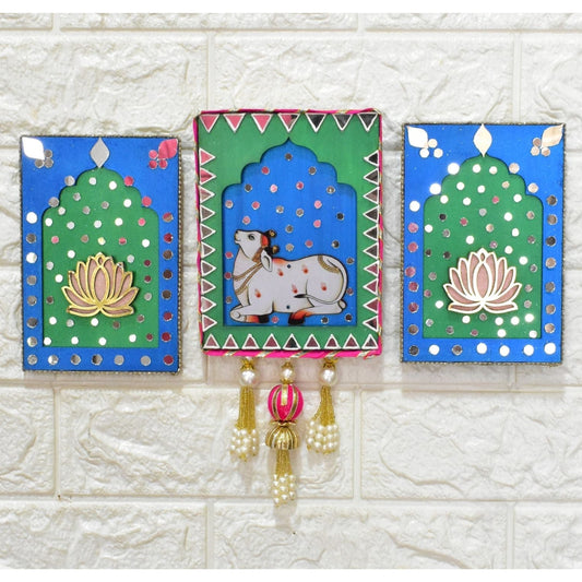 Blue & Green Decorative wall hangings jharokha with lotus and cow designs in on a textured white background