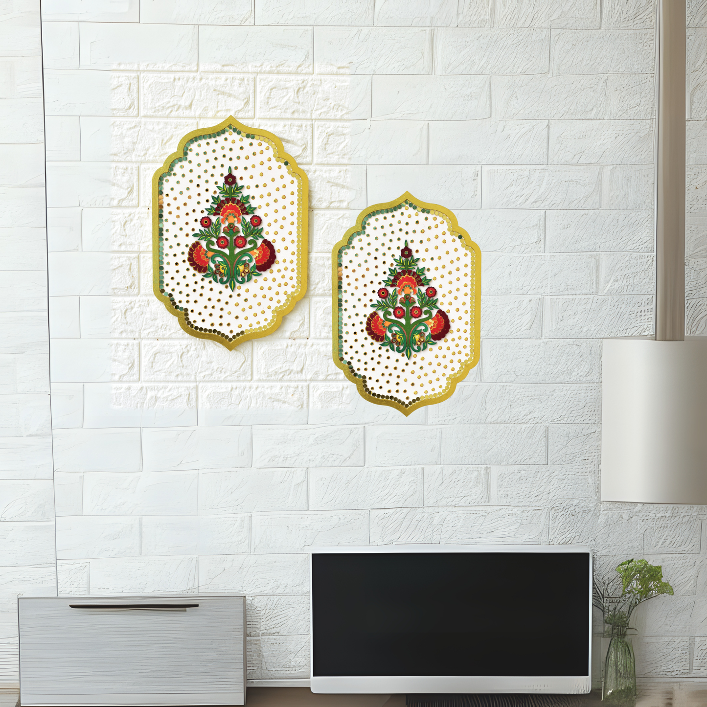 Two decorative wall hangings on a white brick wall.