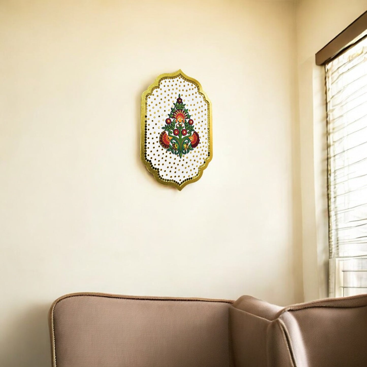 Decorative wall art with floral design on a beige wall above a brown sofa.