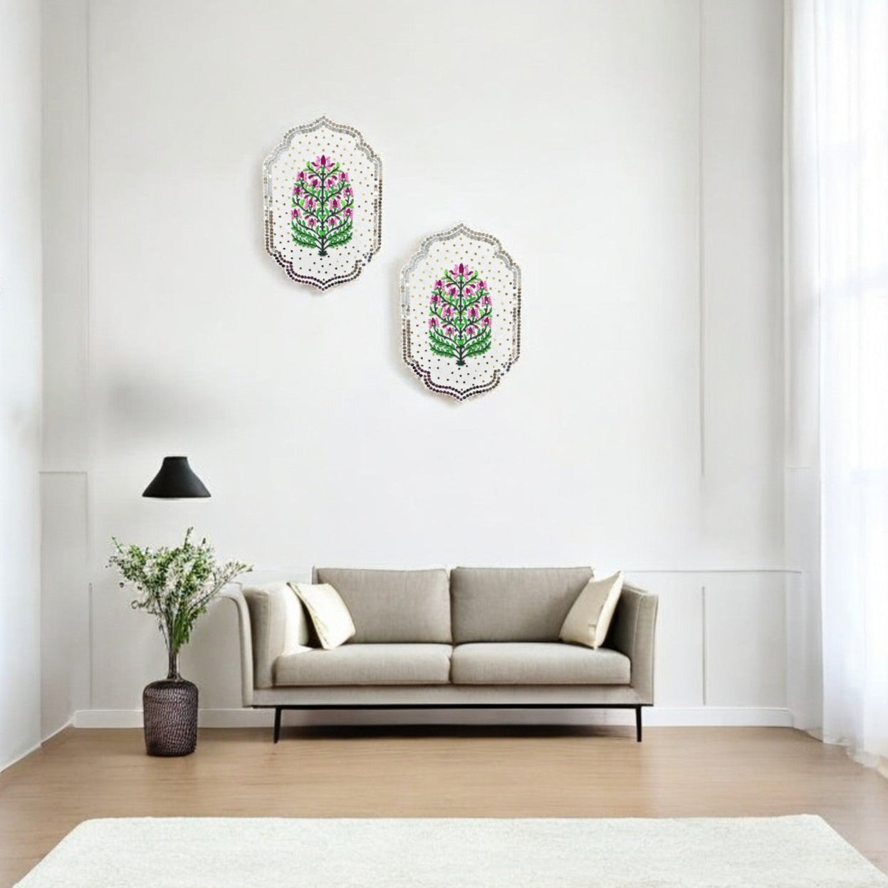 Living room with a gray sofa, decorative pillows, and wall art featuring floral designs.