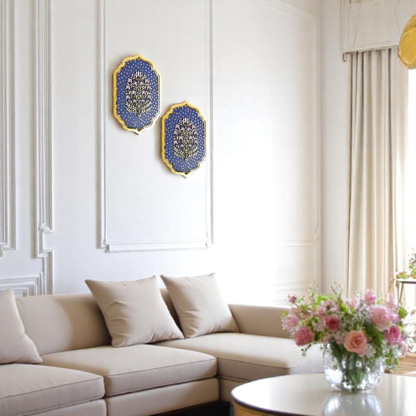 Living room with beige sectional sofa, decorative pillows, and wall art.