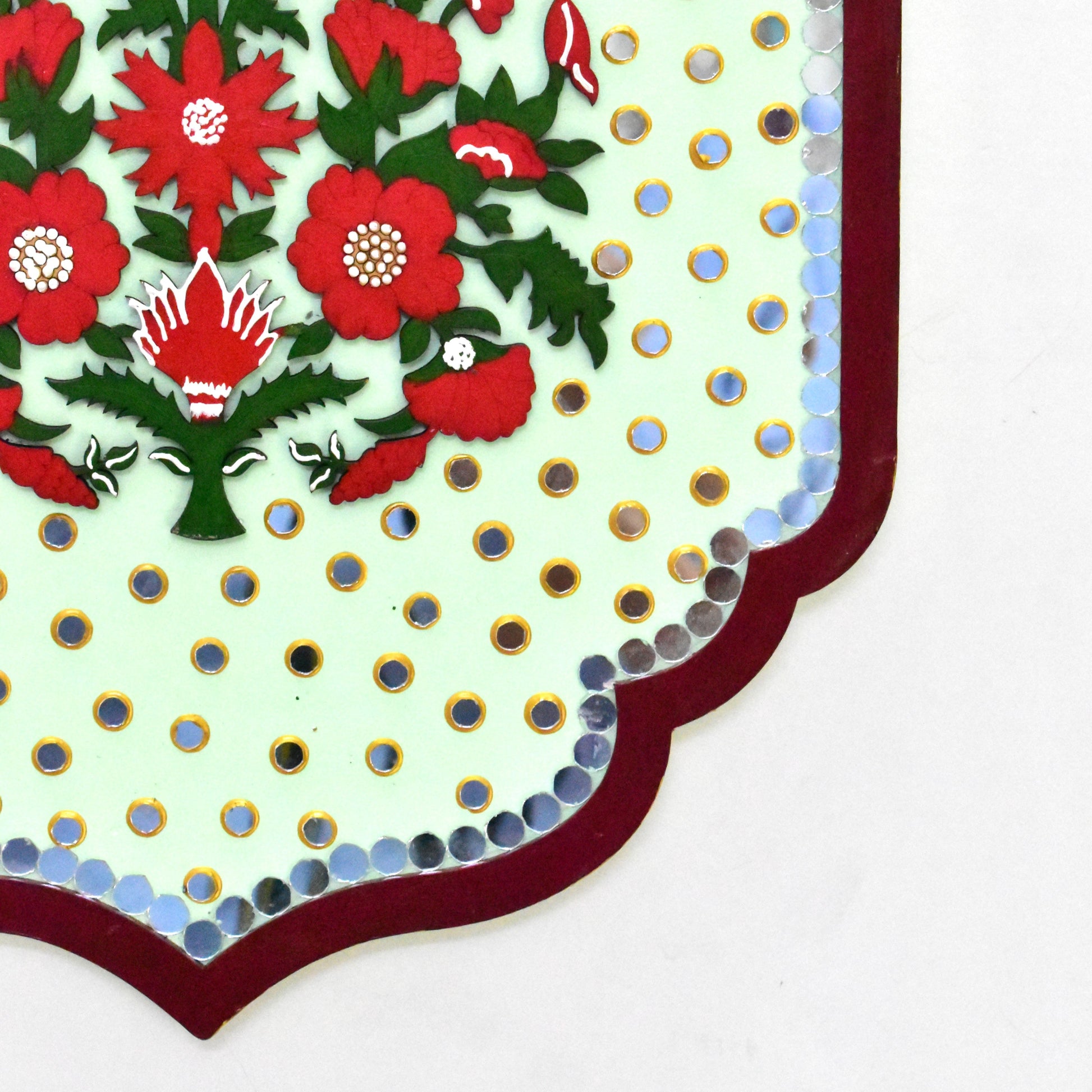 Decorative fabric with red floral pattern on a white background