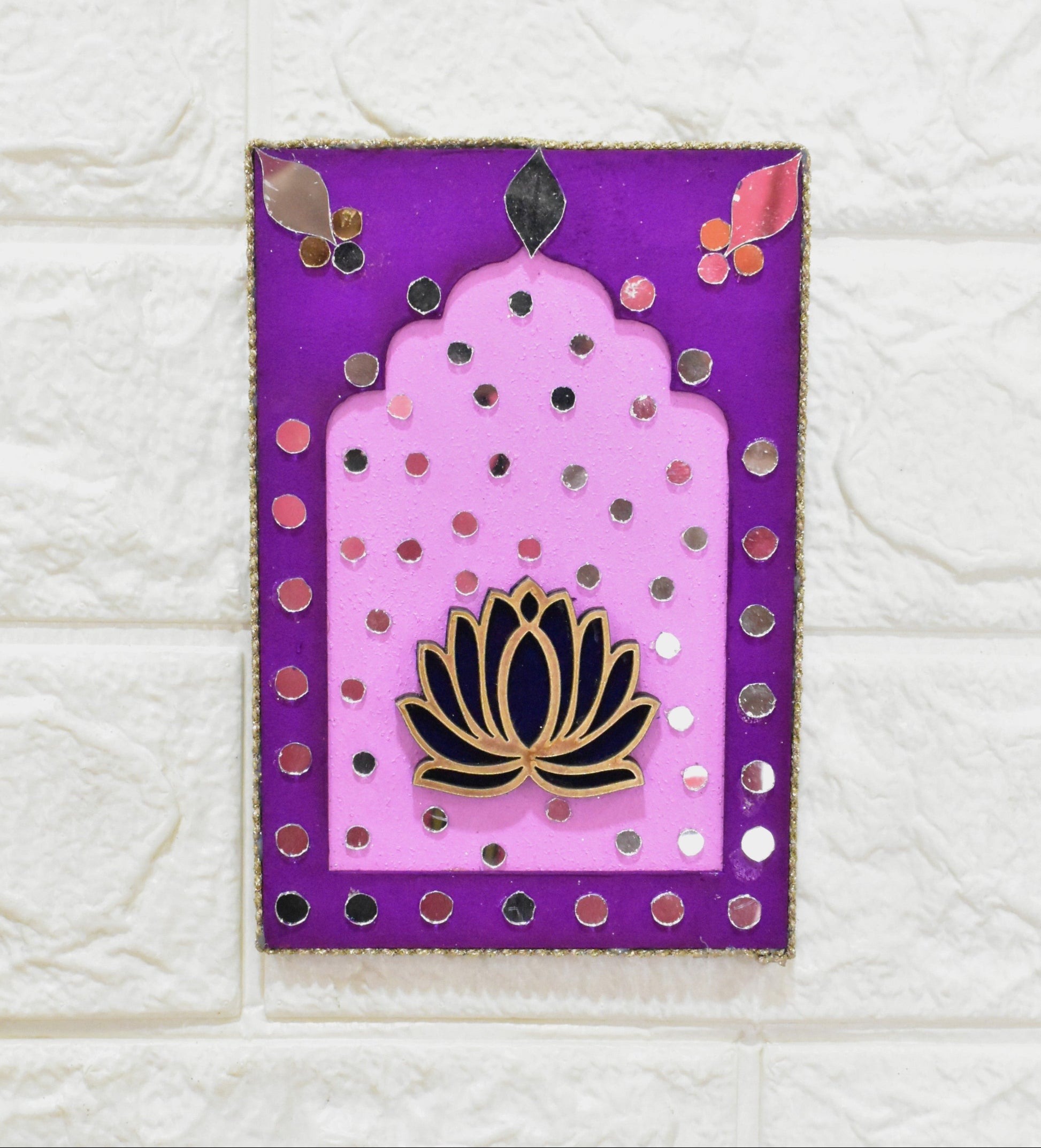 Decorative card with a purple border and pink center featuring a black lotus design on a textured white background.