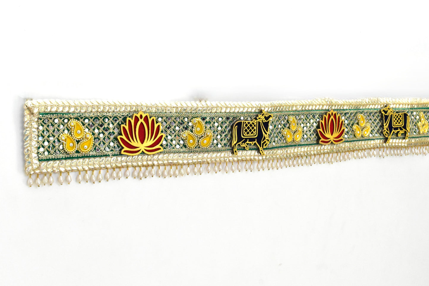 Decorative toran with floral and animal patterns on a white background