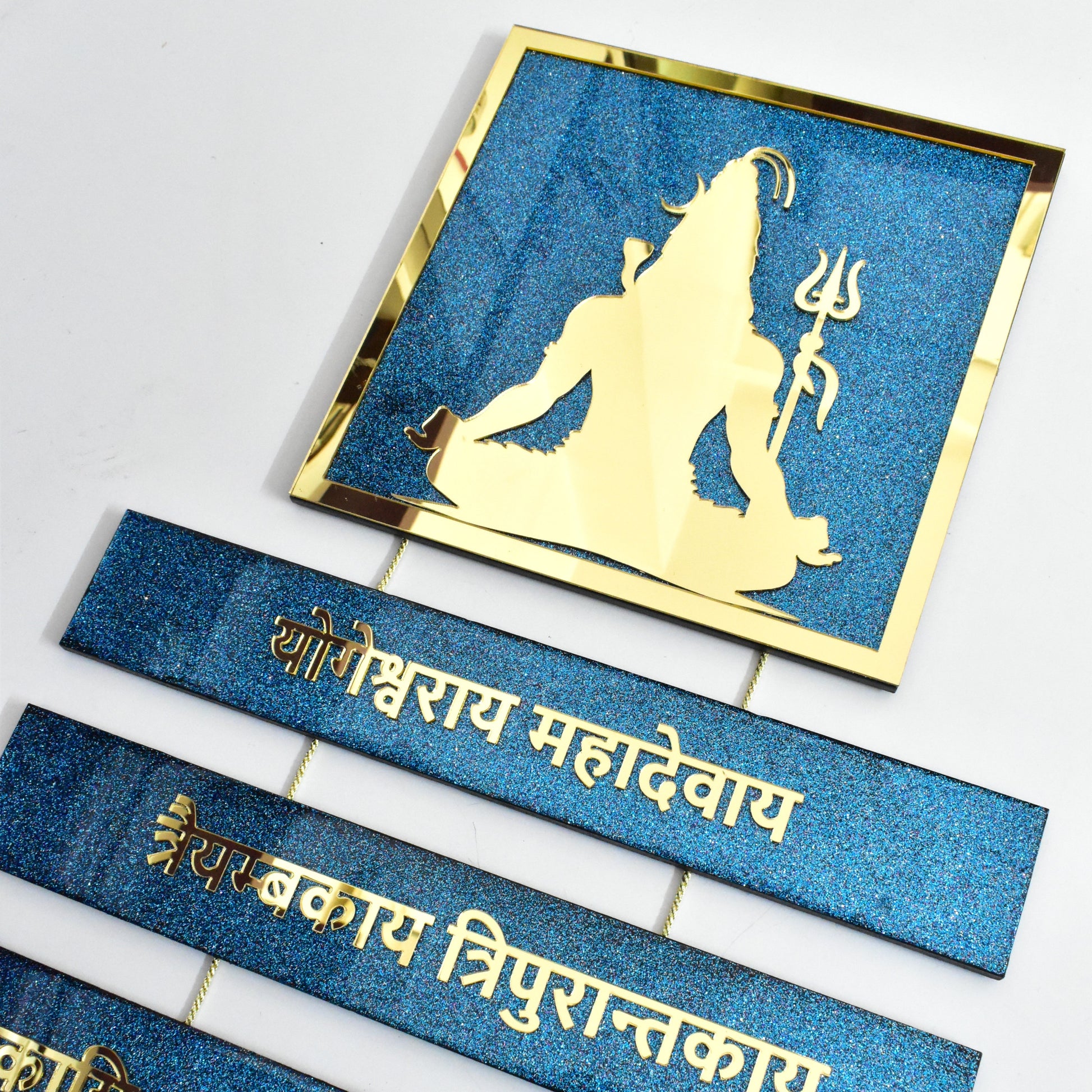 Decorative items with Shiva statue and text on a white background