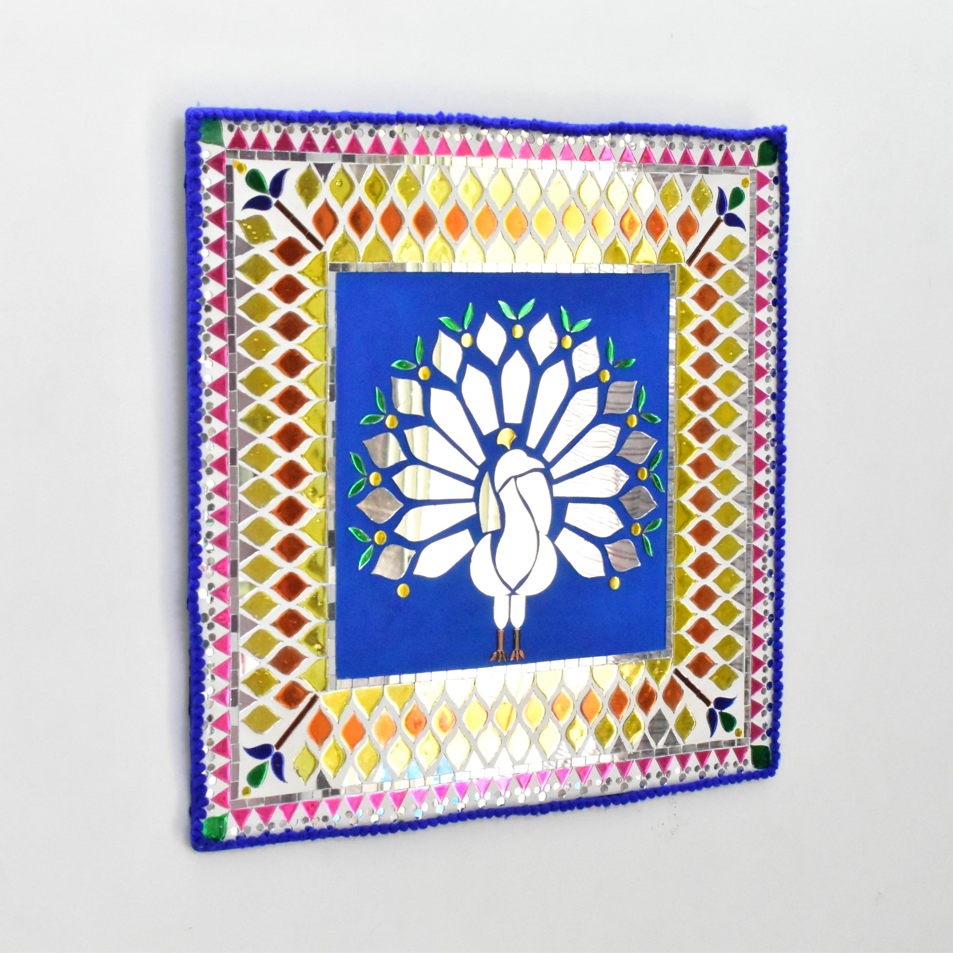 Decorative wall art with a colorful border and central design on a white background