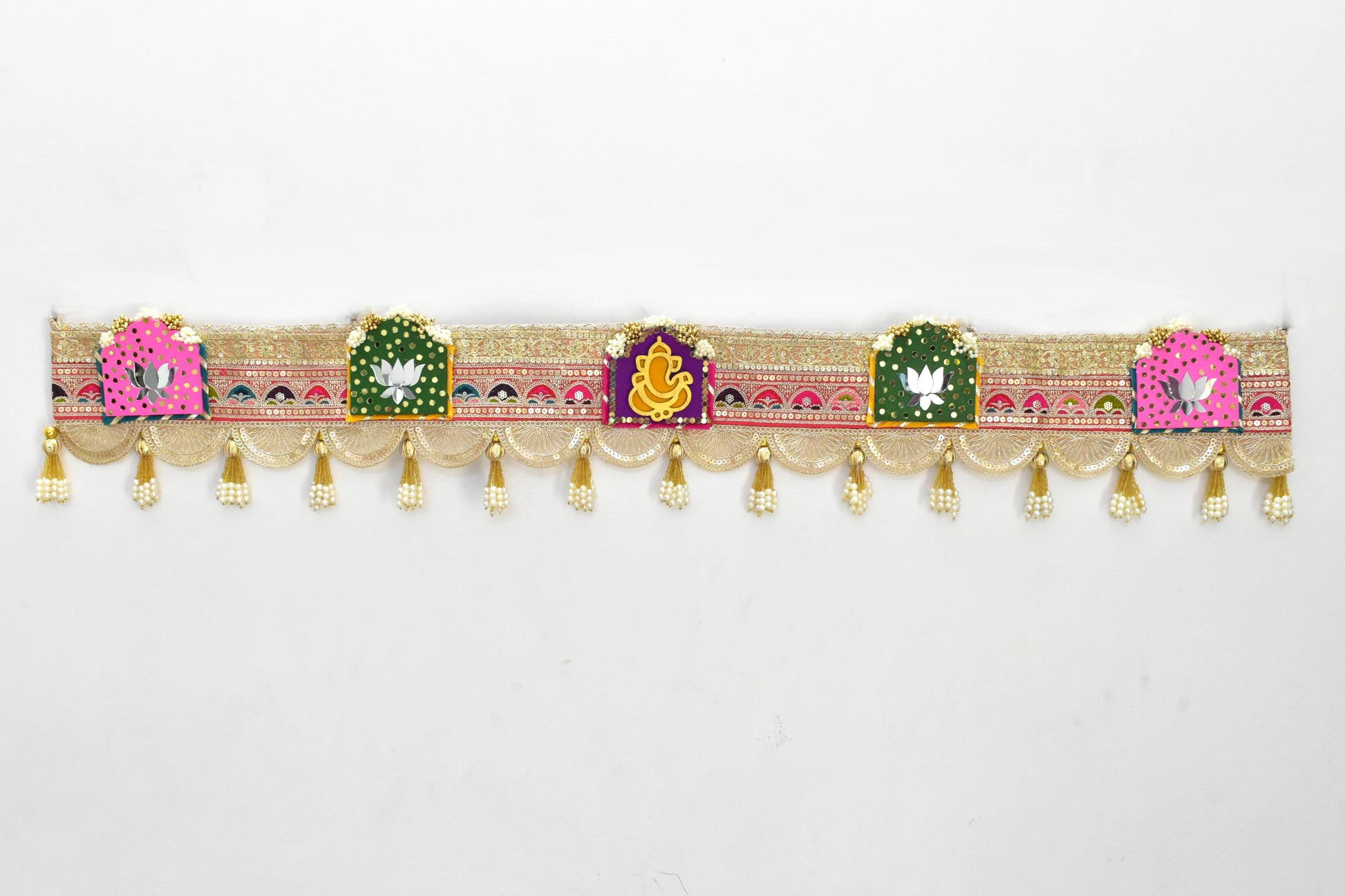 Decorative toran with colorful patterns and gold elements on a white background
