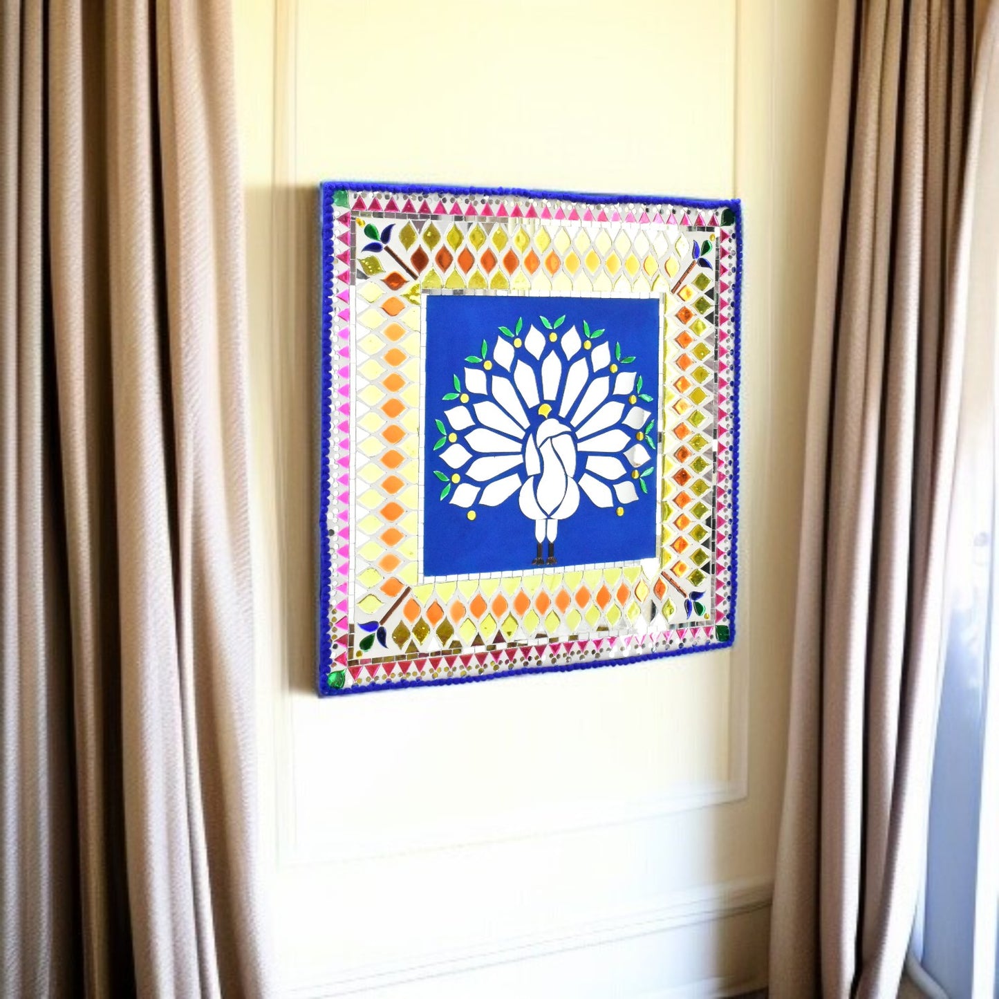 Decorative wall art with a colorful mirror border and peacock central design on a plain wall.