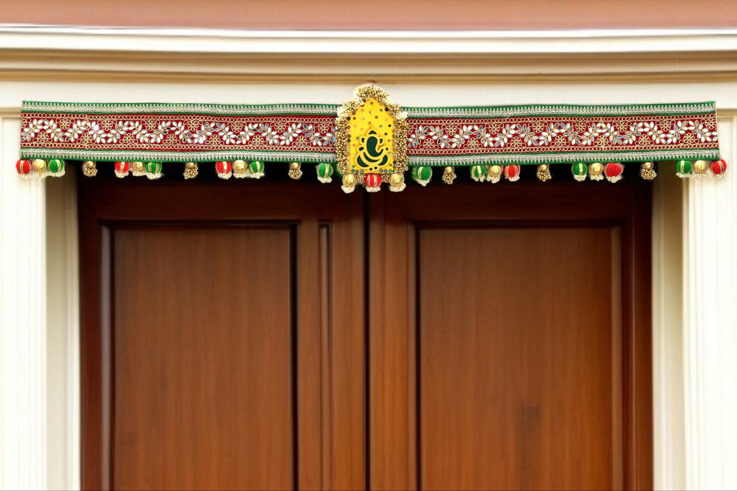 Decorative door toran hanging with colorful elements on a wooden door