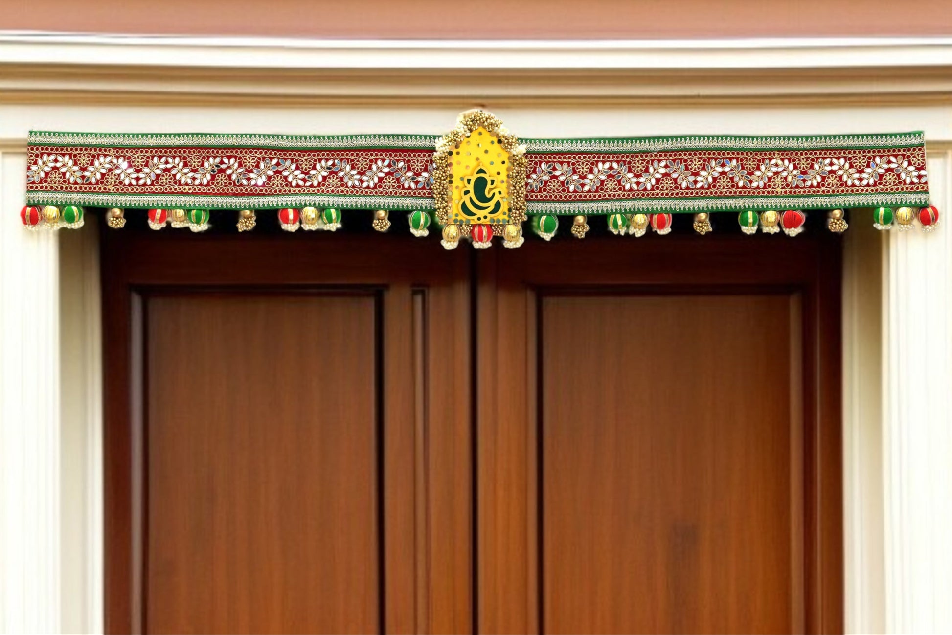 Decorative door toran hanging with colorful elements on a wooden door