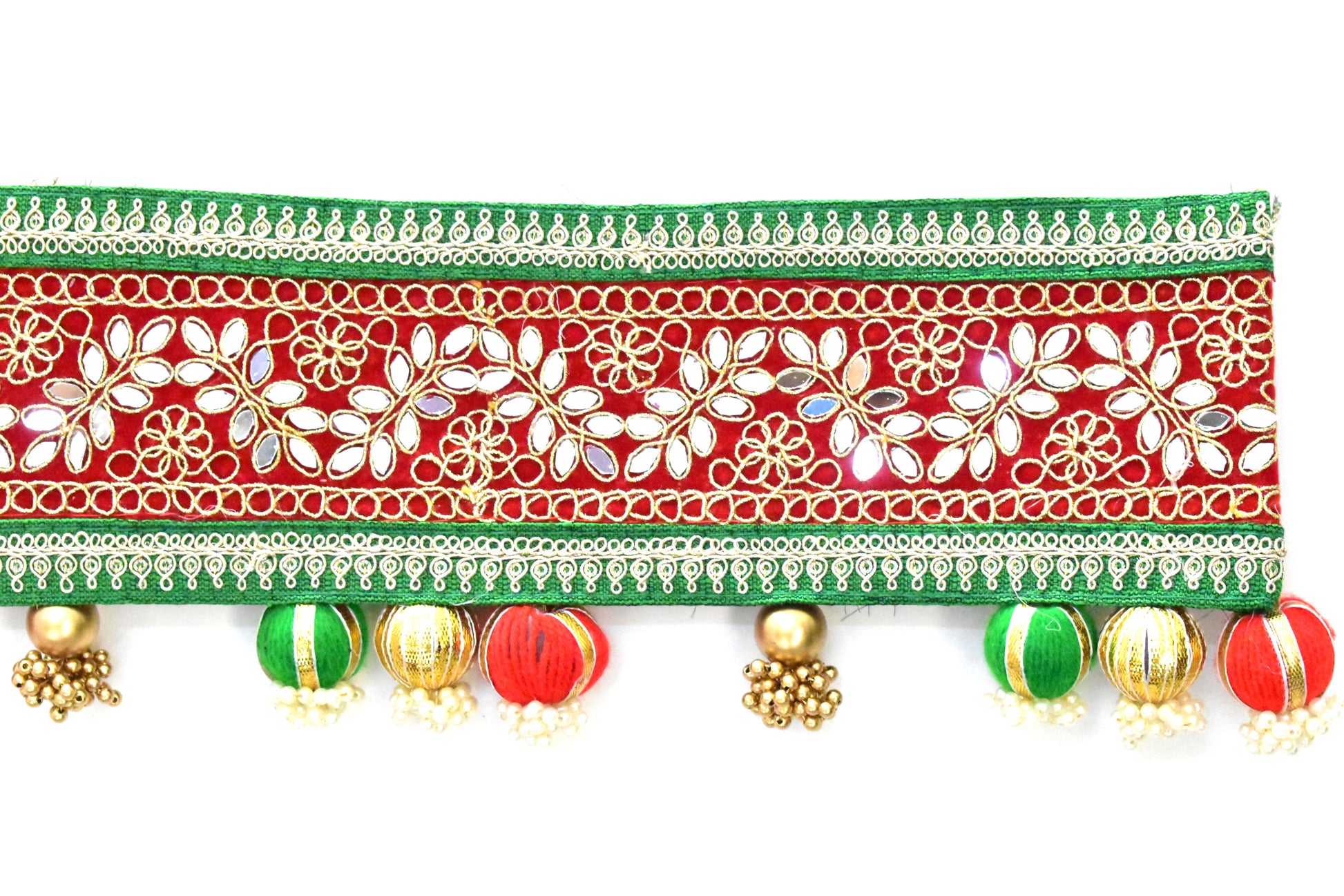 Decorative toran with floral patterns, beads, and tassels on a white background