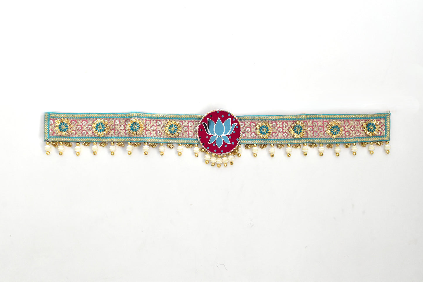 Decorated toran door hanging with floral patterns and a central lotus design on a white background