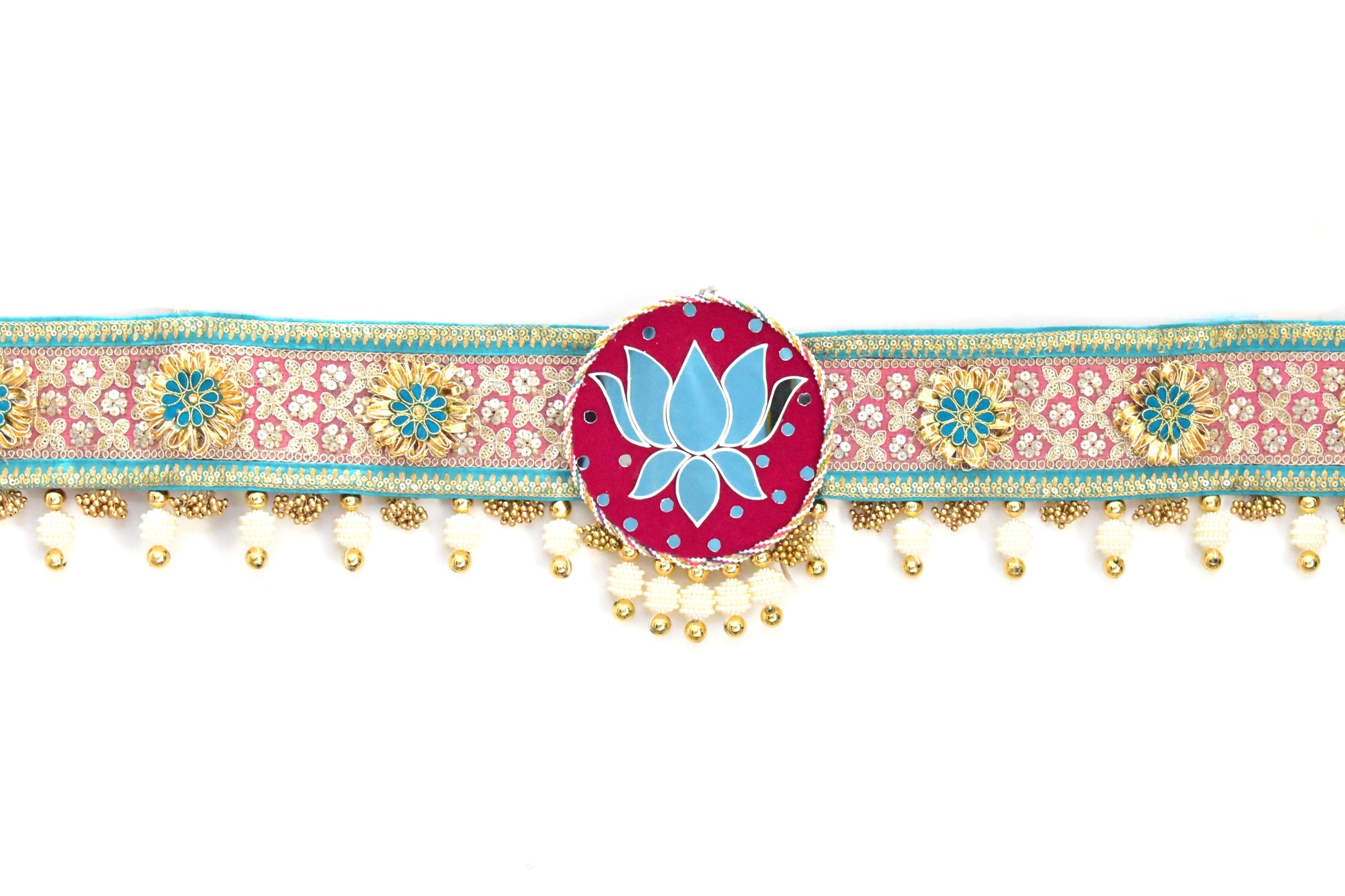 Decorative toran door hanging with floral patterns and a central blue lotus design on a white background