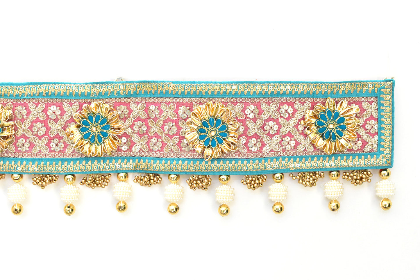 Decorative toran with pink border with gold flowers and pearls on a white background