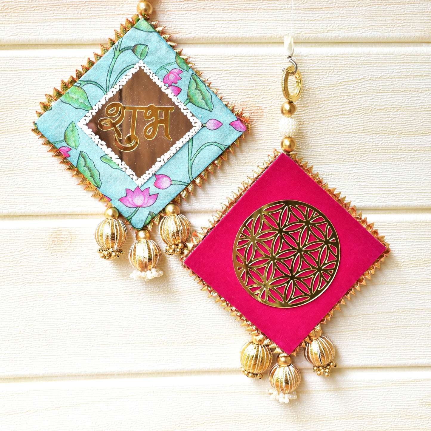 Decorative Shubh Labhs with colorful square designs and gold accents