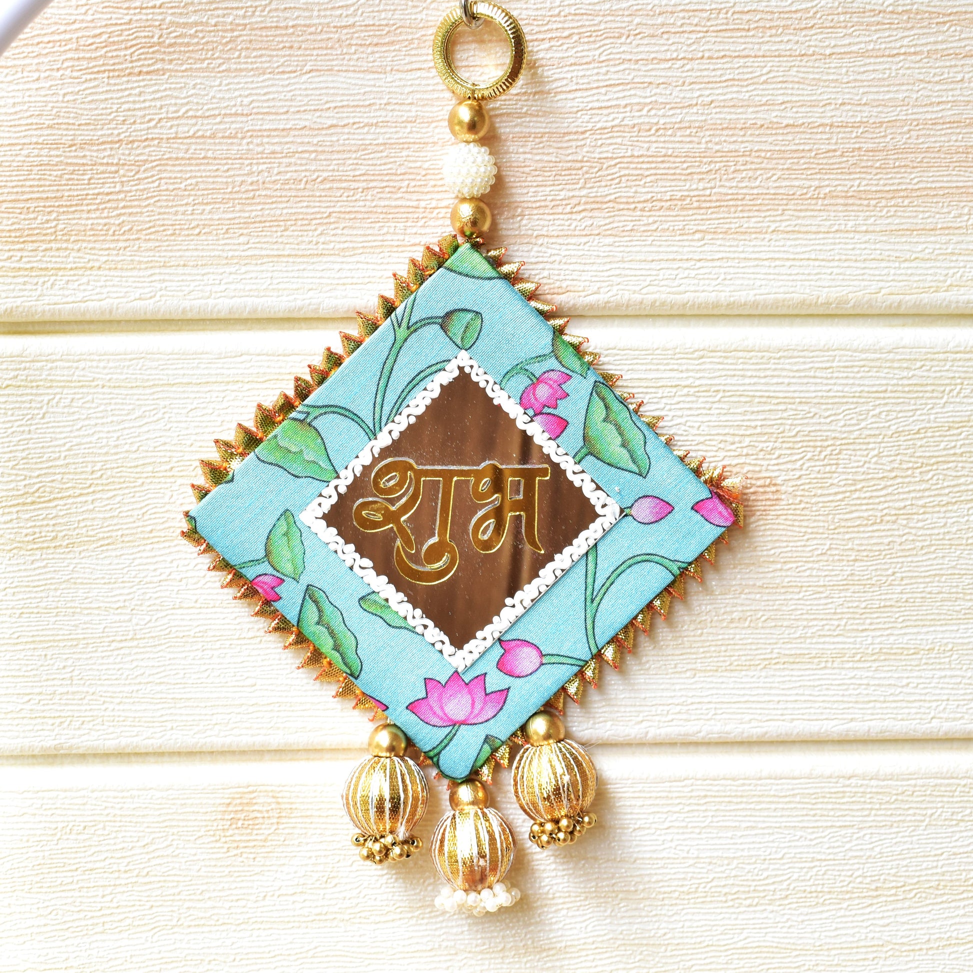 Decorative Shubh with floral design and gold accents