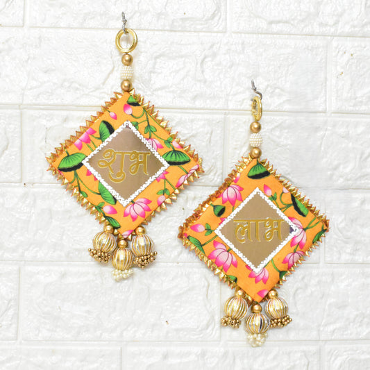 Decorative Shubh Labhs with floral patterns and gold accents