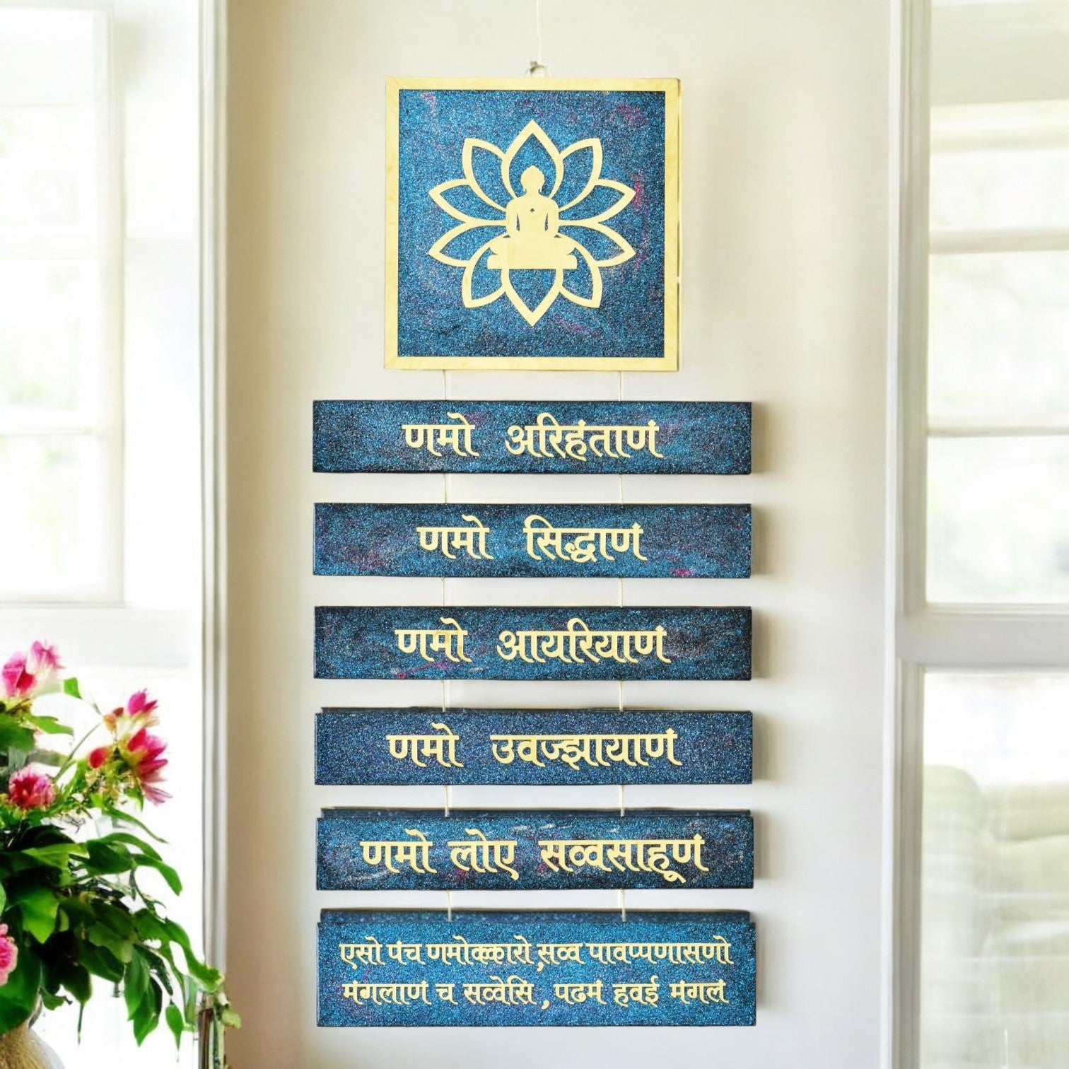 Set of blue plaques with gold text on a white wall, accompanied by a framed lotus design. Jain Navkar Mantra with Mahavir Bhagwan