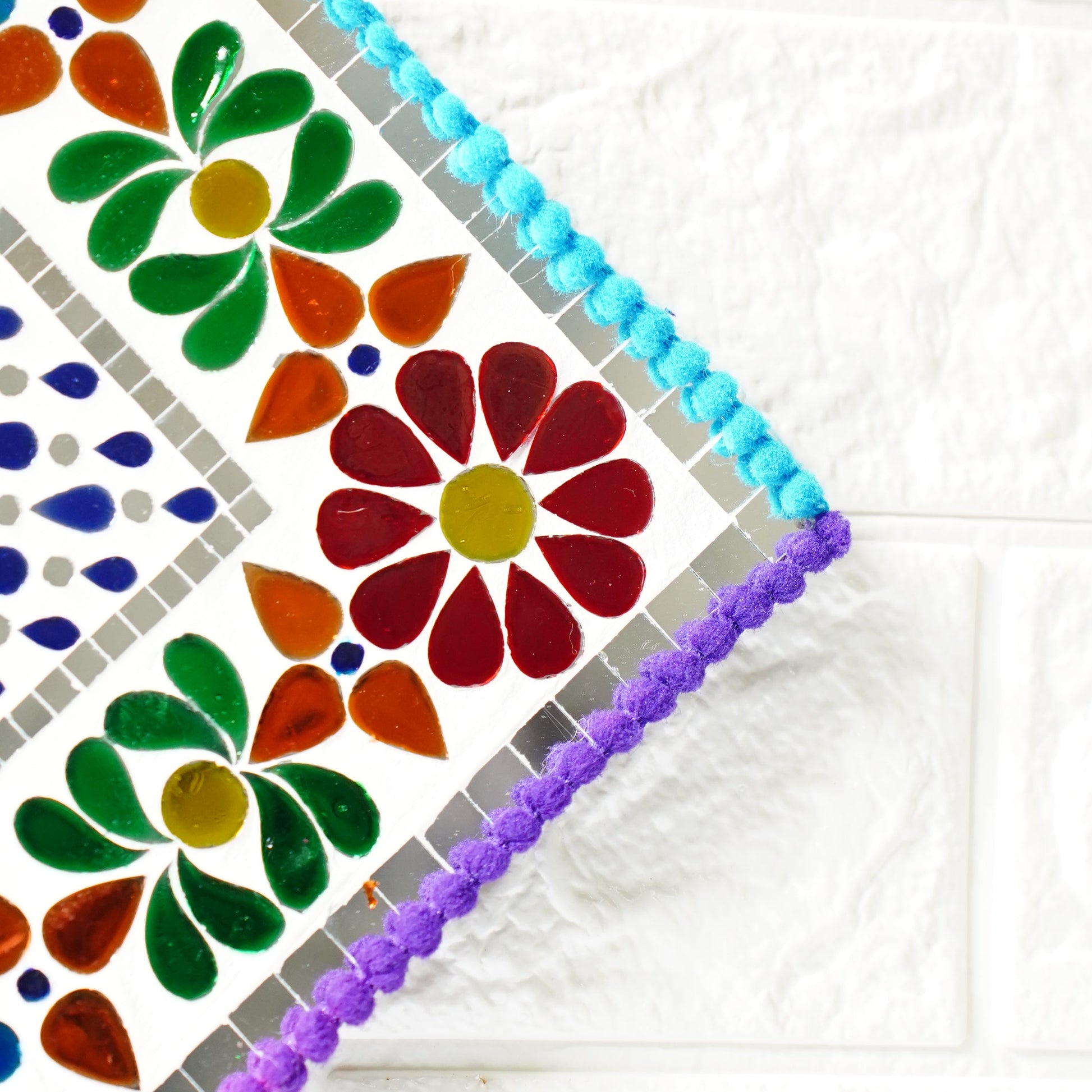 Colorful floral patterned wall art with a white background