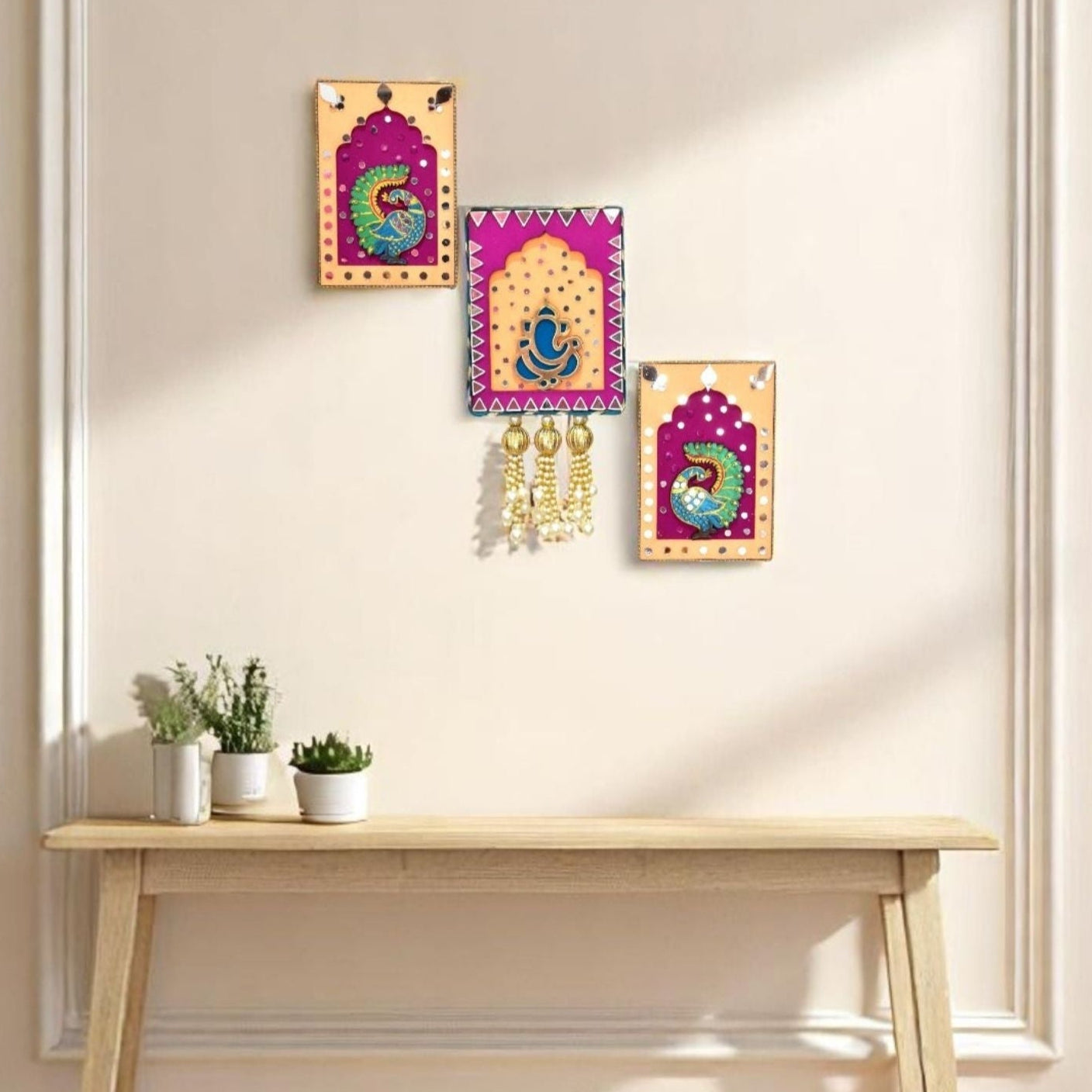 Pink & Orange handmade Ganesha & Peacock Jharokha Wall Hanging in the living room.