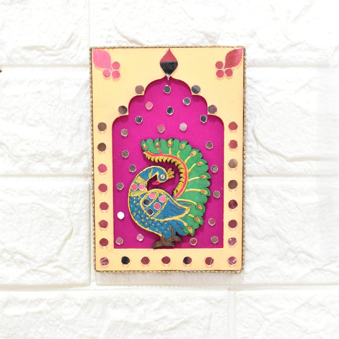 Decorative wall hanging jharokha with a peacock design with orange and pink with mirror work.
