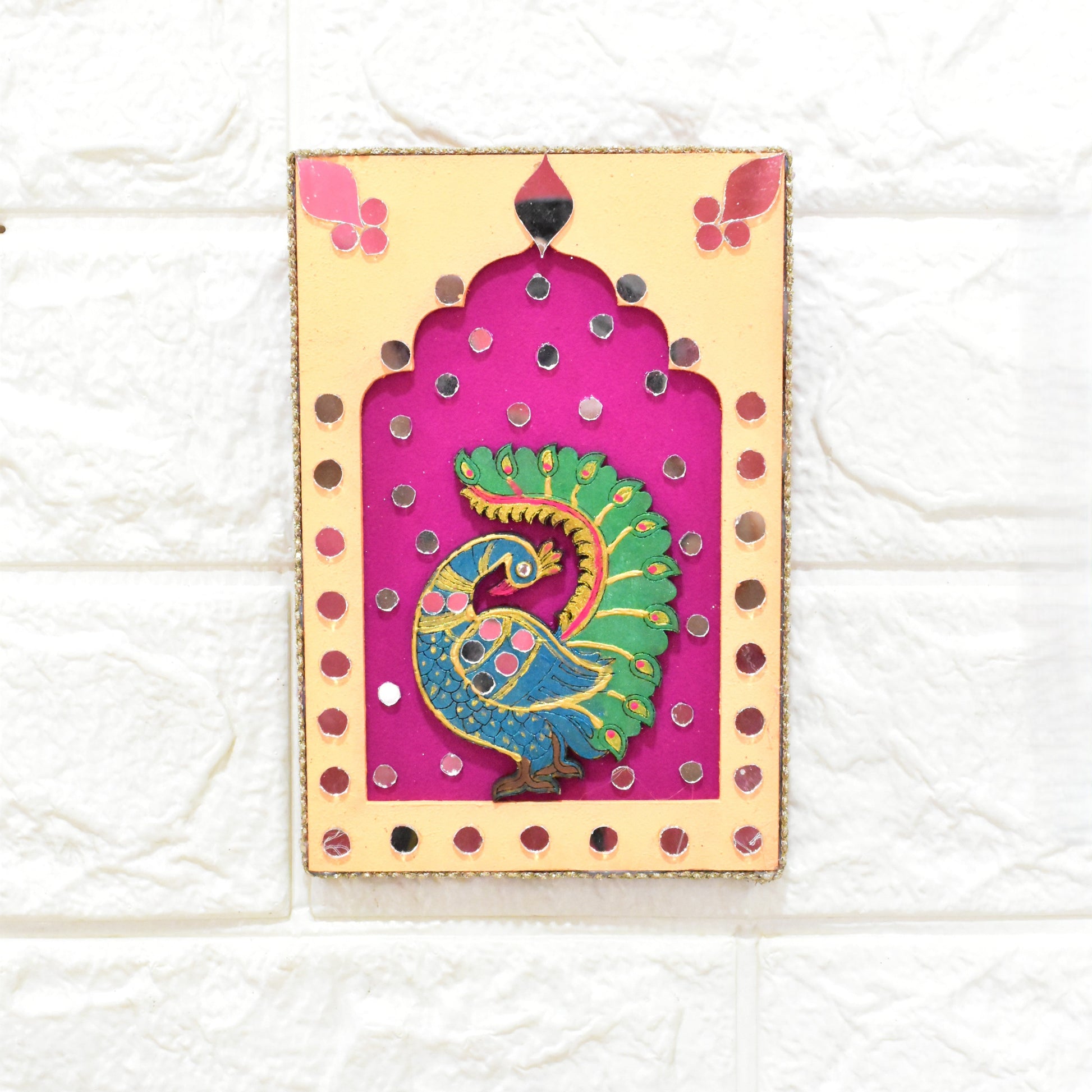 Decorative wall hanging jharokha with a peacock design with orange and pink with mirror work.