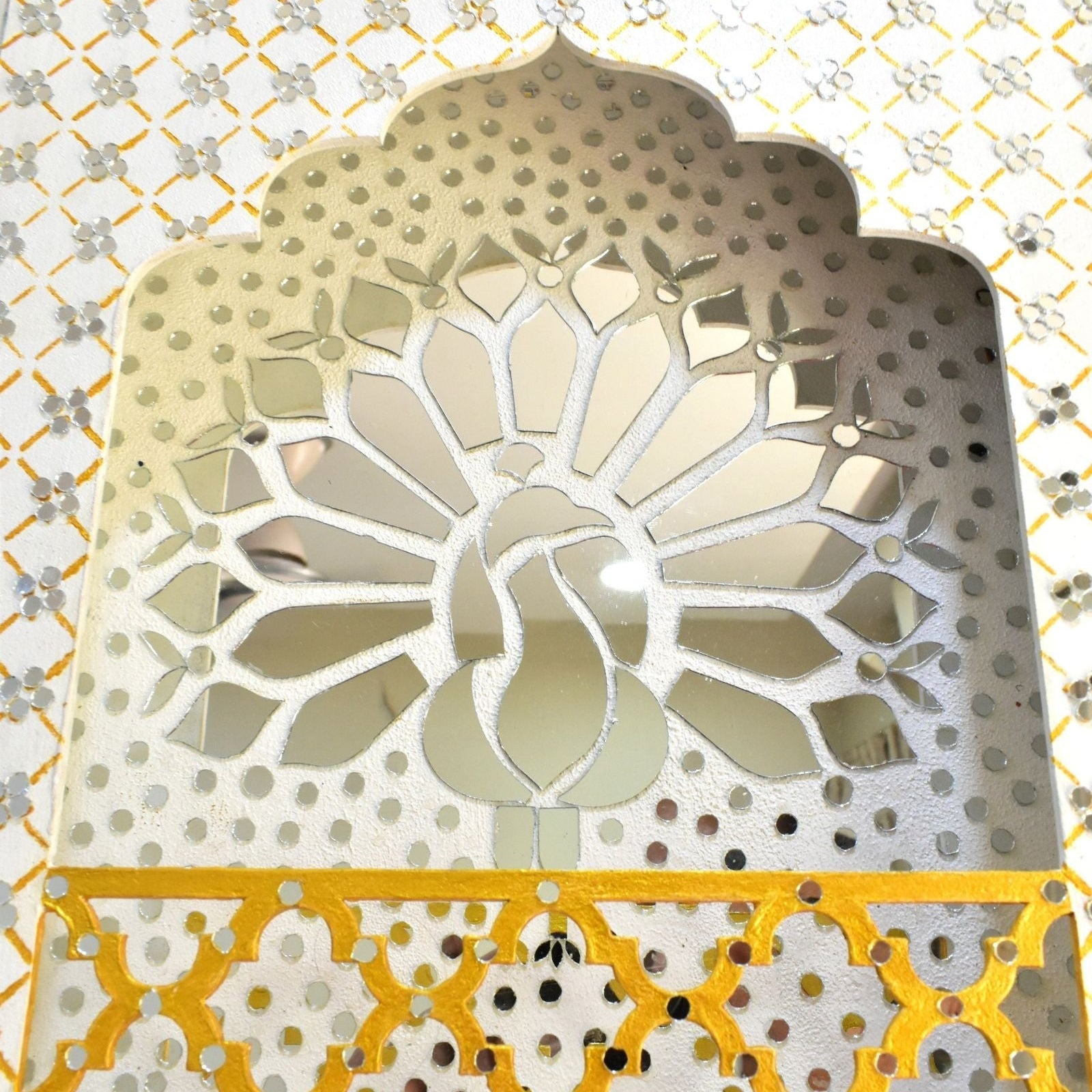 Close up of decorative White wall art with LED lit, geometric pattern and Peacock design