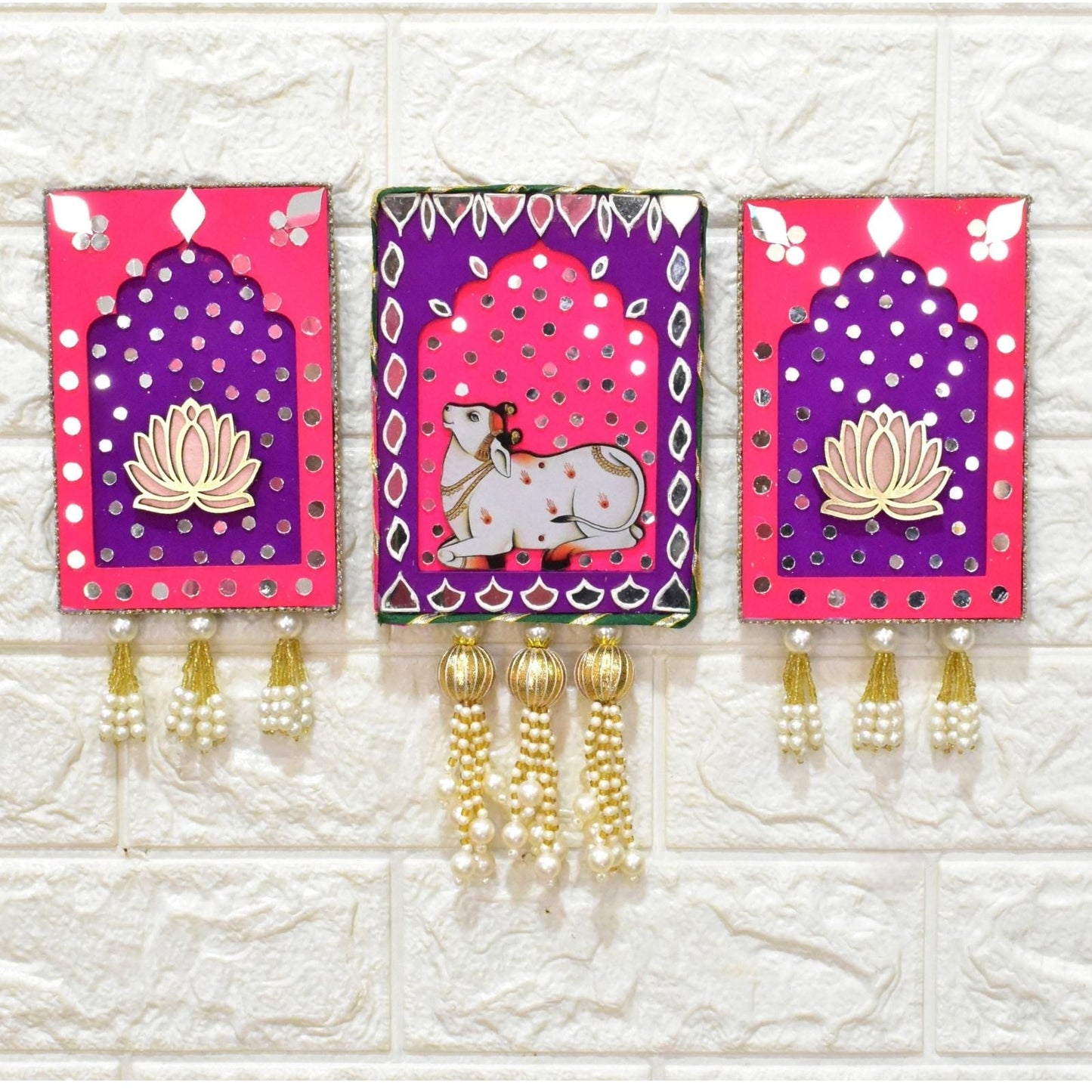 Pink and purple jharokha wall art with cow and lotus with mirrors and gold beads and pearl tassels