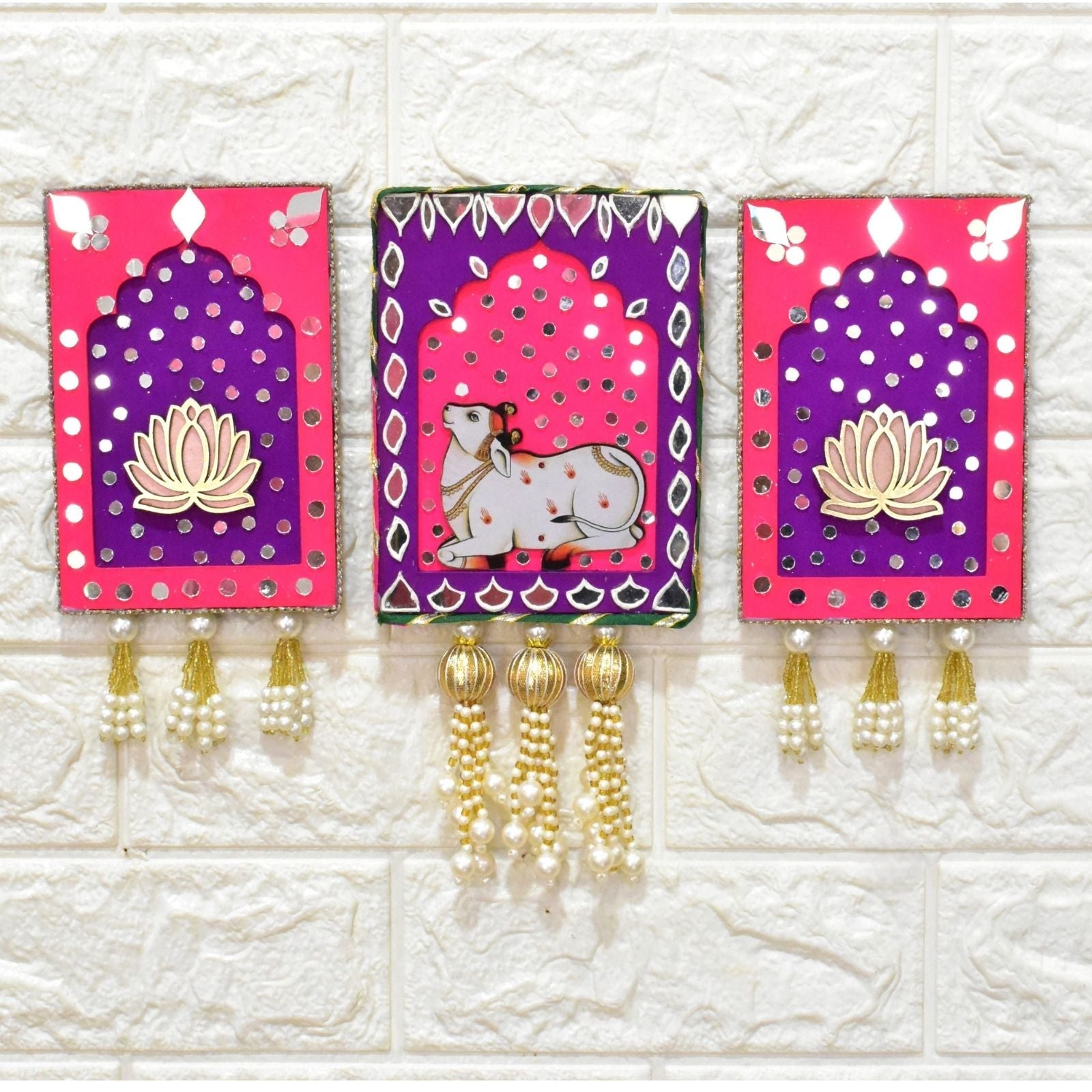 Pink and purple jharokha wall art with cow and lotus with mirrors and gold beads and pearl tassels