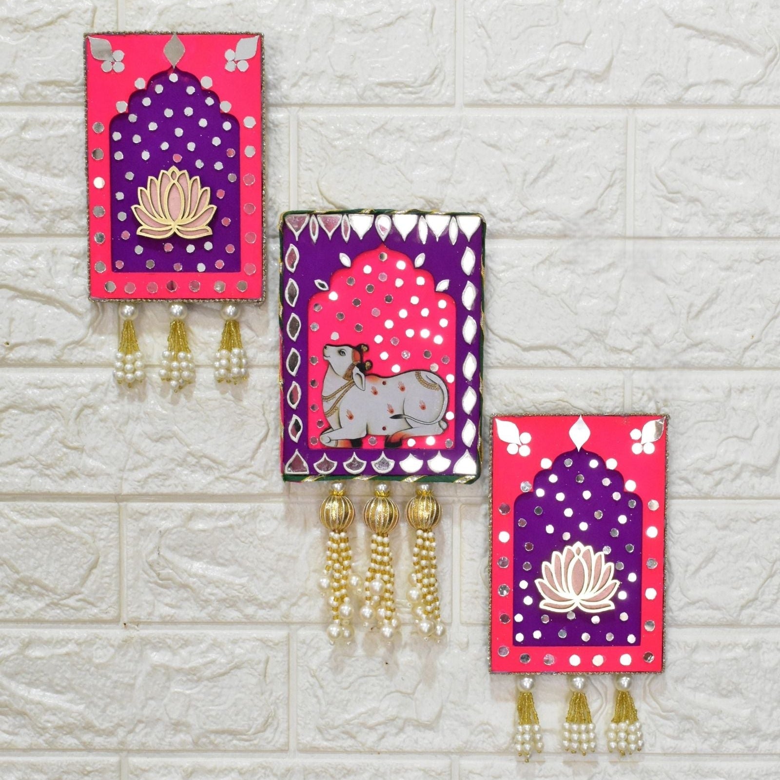 Pink and purple jharokha wall art with cow and lotus with mirrors and gold beads and pearl tassels