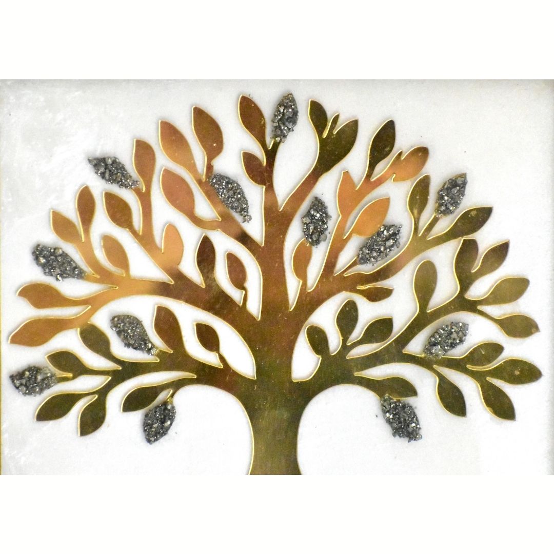 Close of white and gold pyrite Tree of Life frame vastu decor on a white background