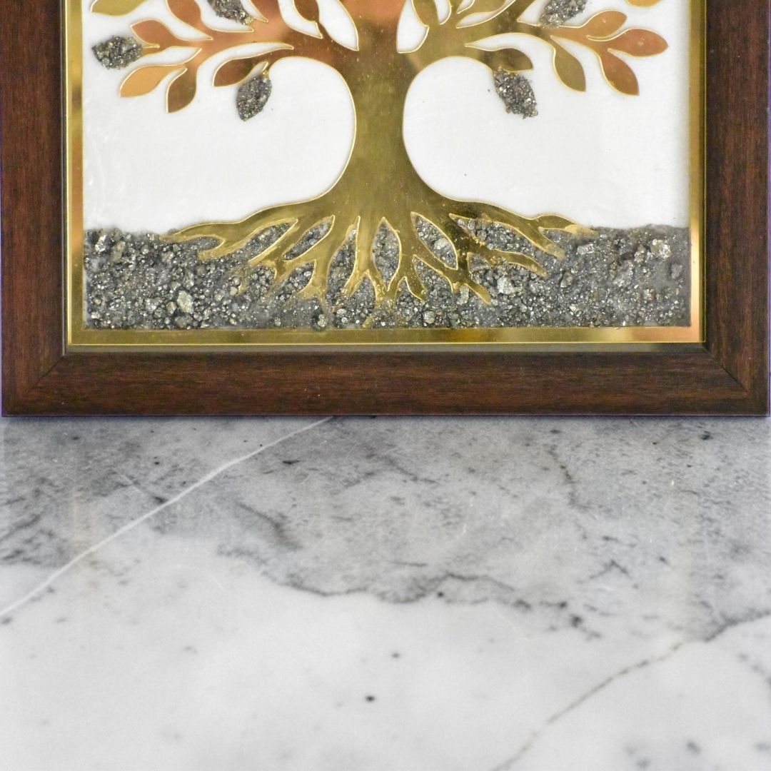 Close up of wall frame with a pyrite Tree of Life design on a marble surface