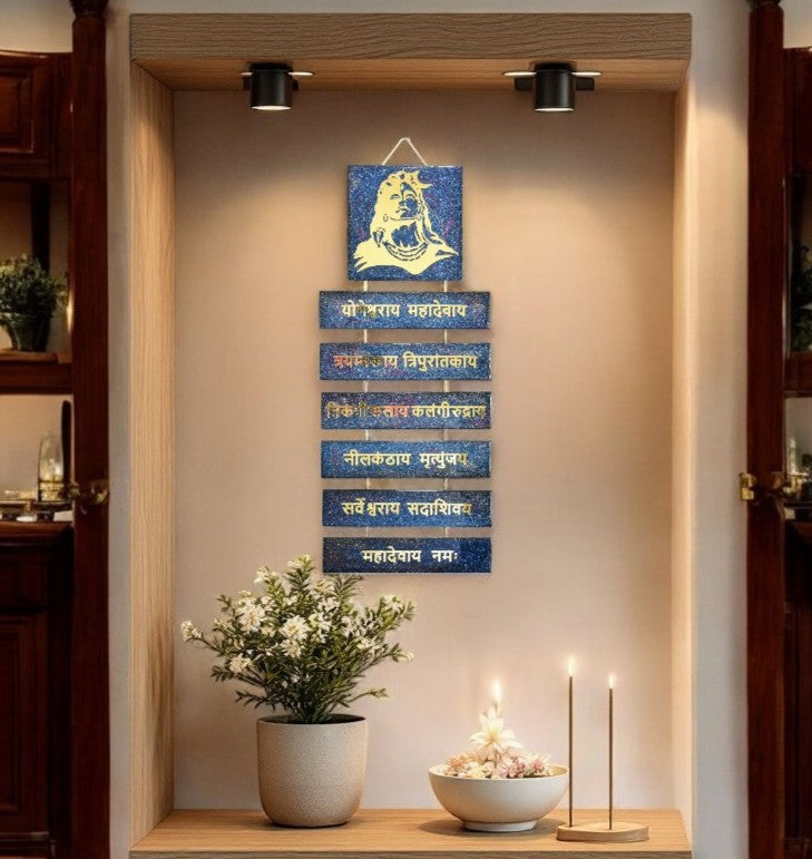 Decorative wall art with blue and gold elements in a home setting.