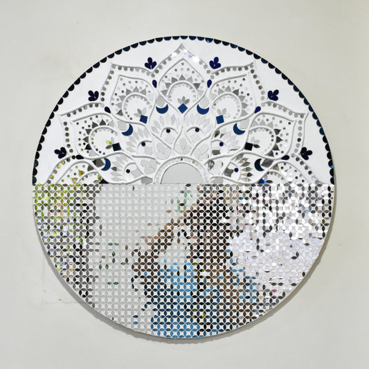 Circular mandala mirror mosaic art piece with intricate patterns on a plain background