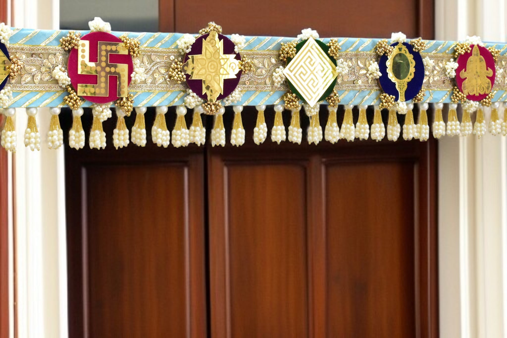 Decorative Toran door made with a theme of ashtamangal jain symbols