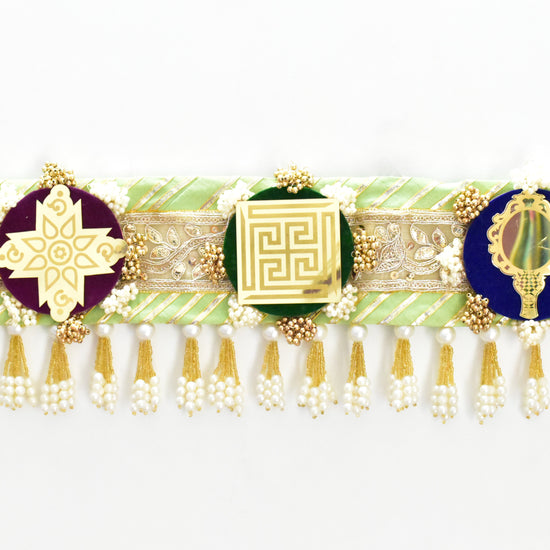 Green handcrafted Ashthamangala toran with traditional mirror work and 8 sacred symbols, ideal for ethnic home décor, door hanging, or pooja room decoration