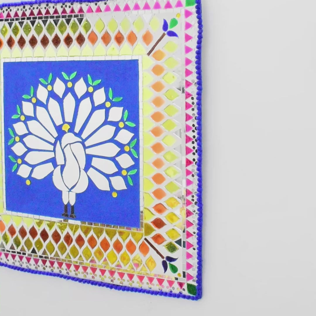 Mirror Mosaic Decorative wall art with a peacock design on a colorful geometric border.